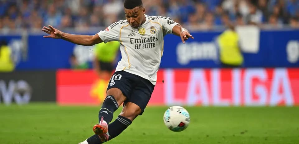 Real Madrid player shooting the ball