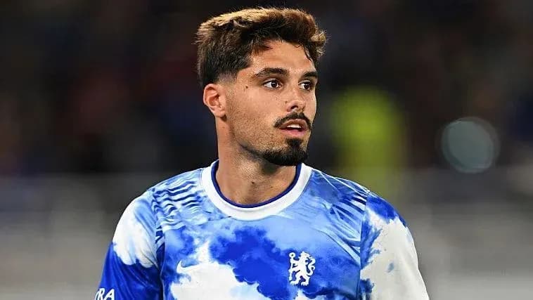 Player in Chelsea jersey during match preparation