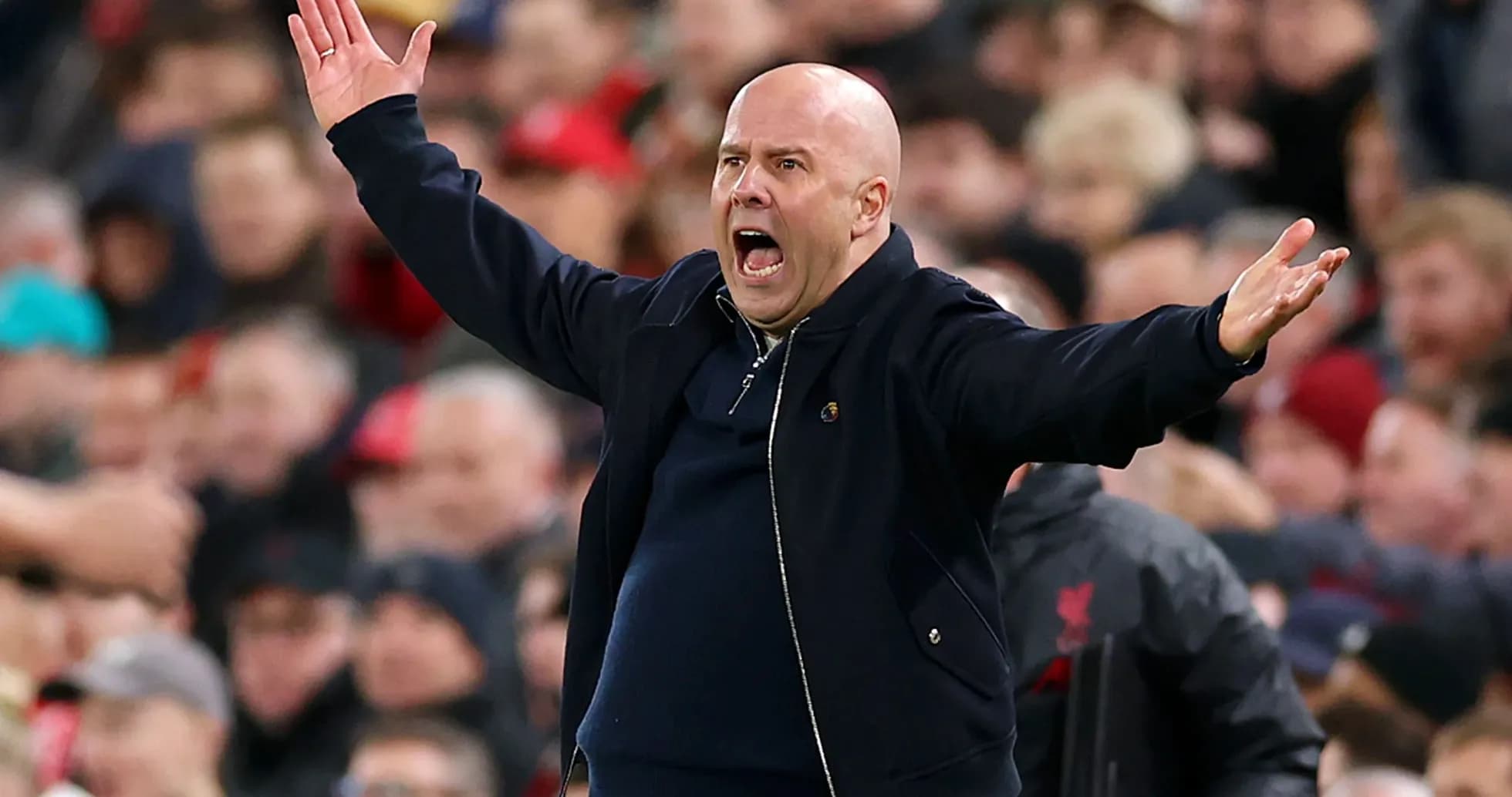 Coach gesturing passionately during the match
