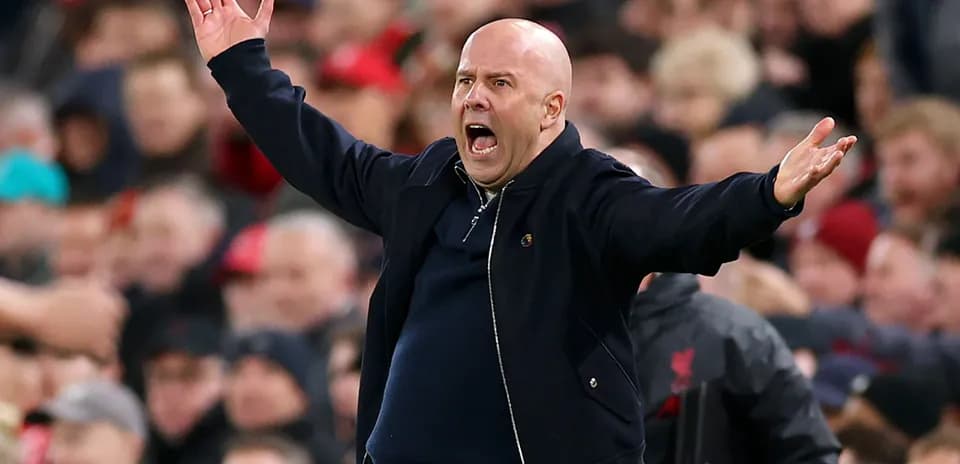 Coach gesturing passionately during the match