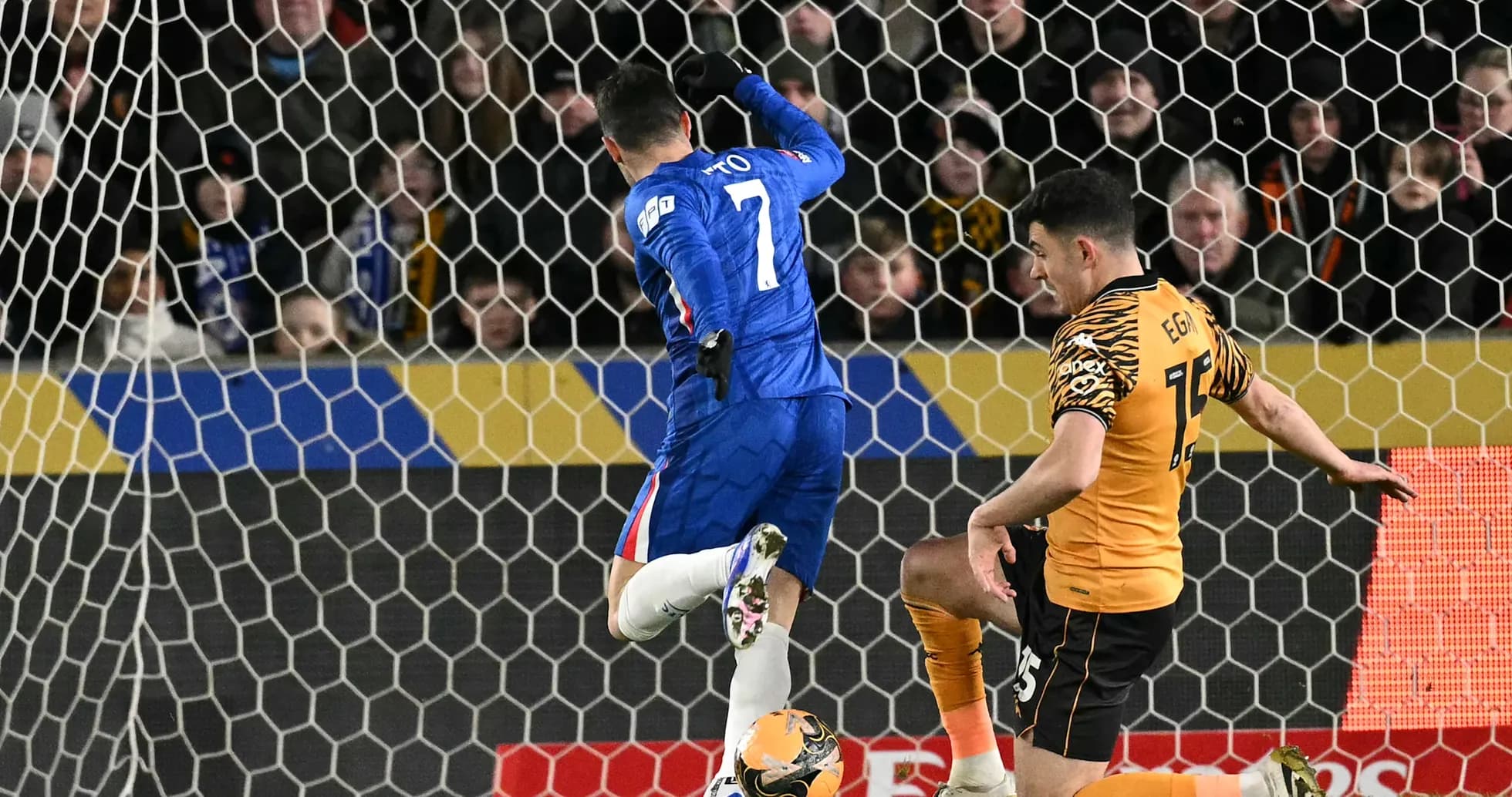 Chelsea player attempting to score against Hull City