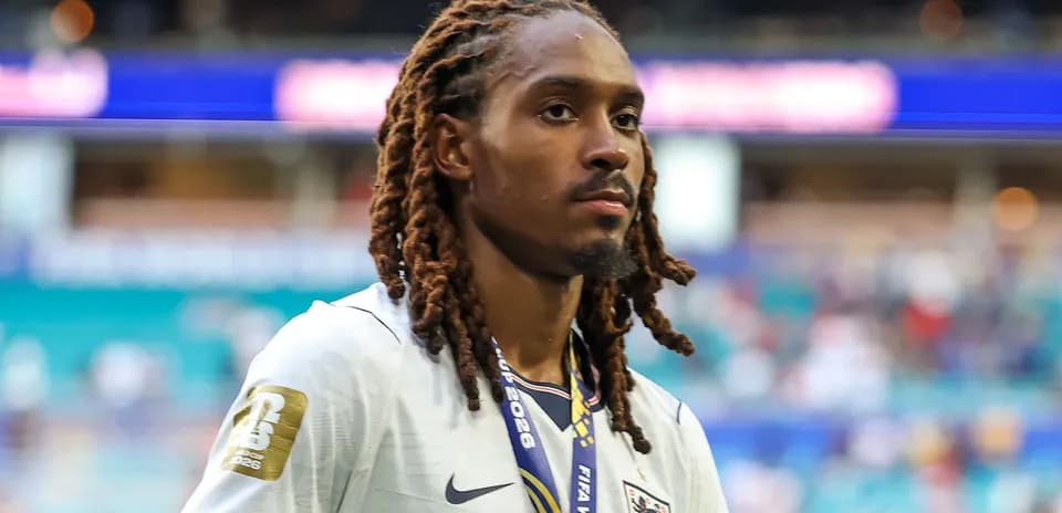 Player wearing England jersey walking off the field