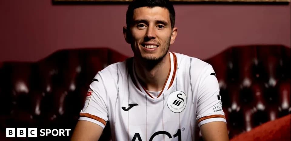 Player wearing Swansea City jersey in studio setting
