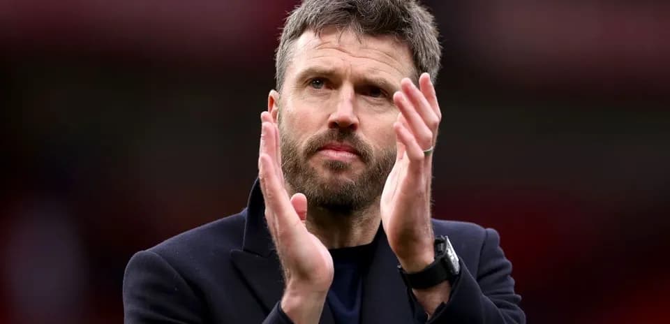 Man applauding in a stadium setting
