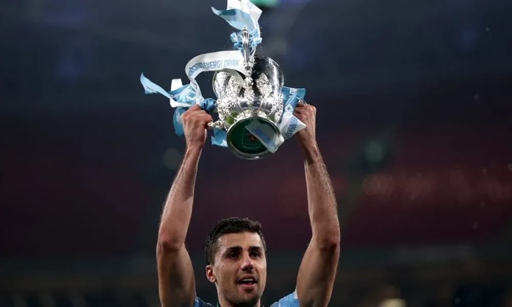 Player lifting trophy with blue ribbons after victory