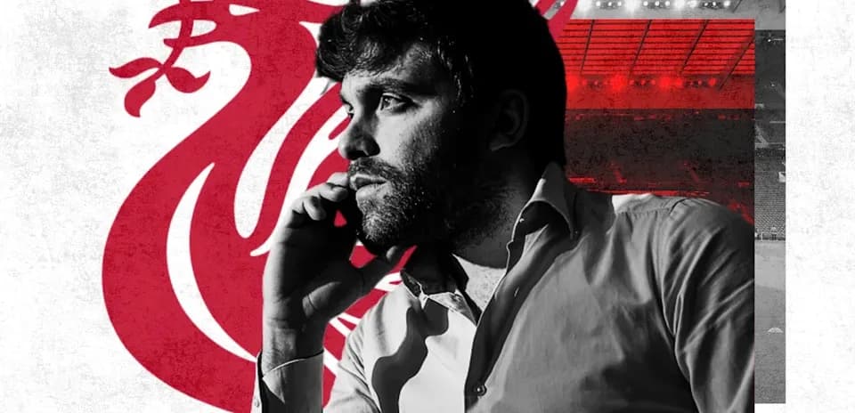 Man on phone with Liverpool FC logo background