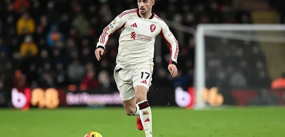 Player dribbling ball during match on field