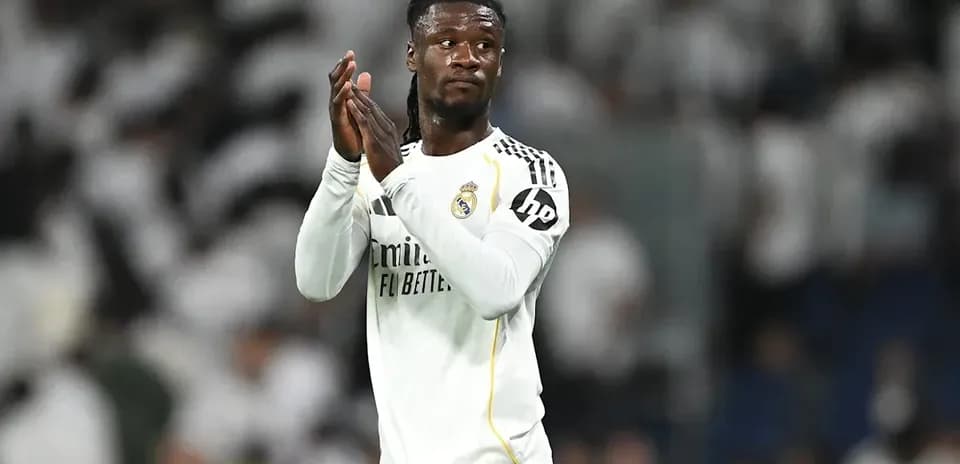 Player applauding fans after match in stadium