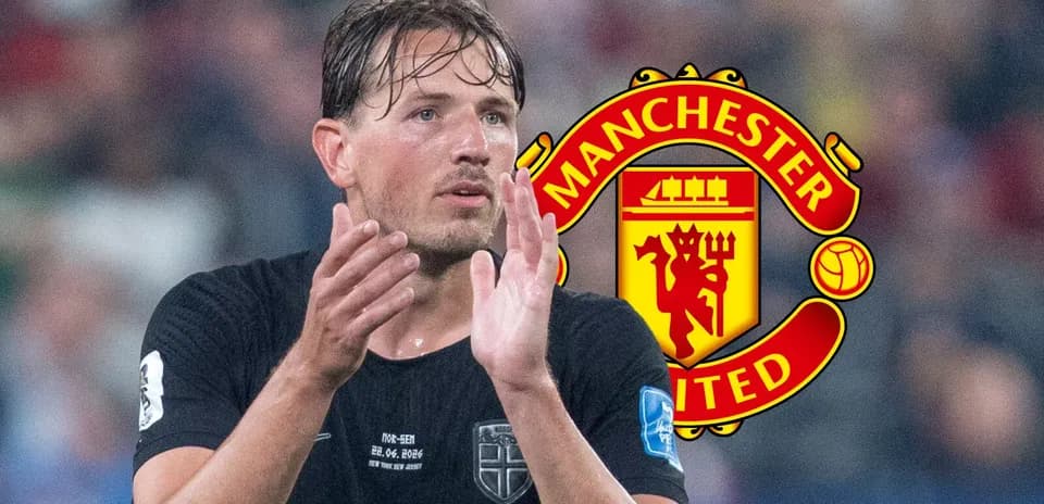 Player applauding with Manchester United logo background