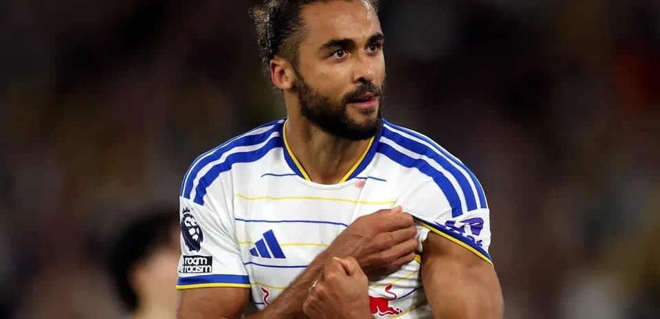 Player adjusting captain's armband during match