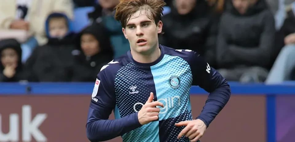 Player running during a football match at stadium