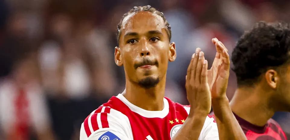 Player applauding fans after match at stadium