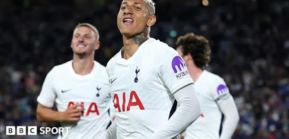 Tottenham players celebrating a goal on the pitch
