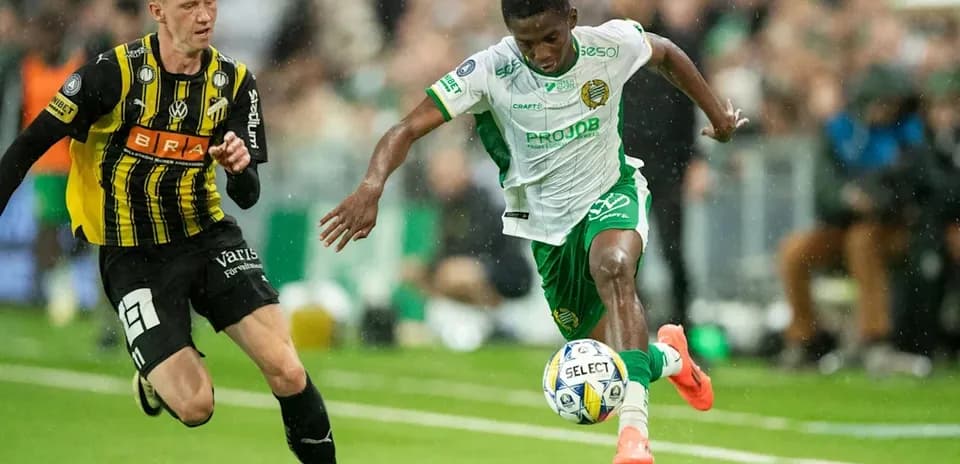 Player dribbling the ball during intense match action