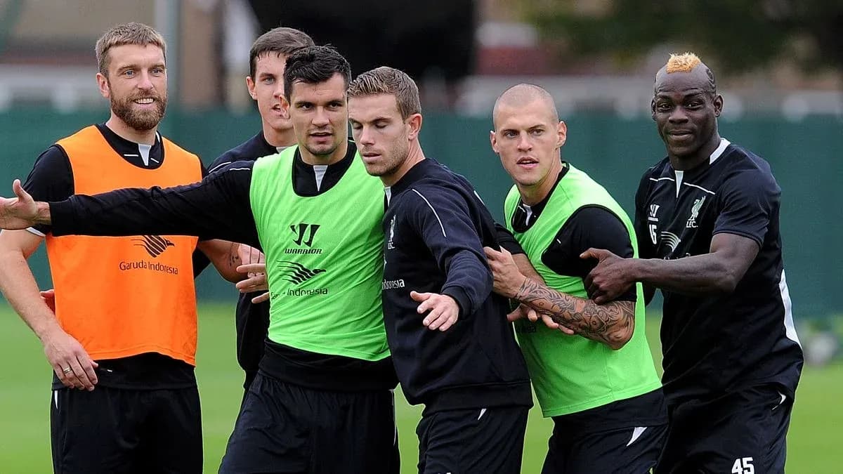 Liverpool players training in green and orange vests