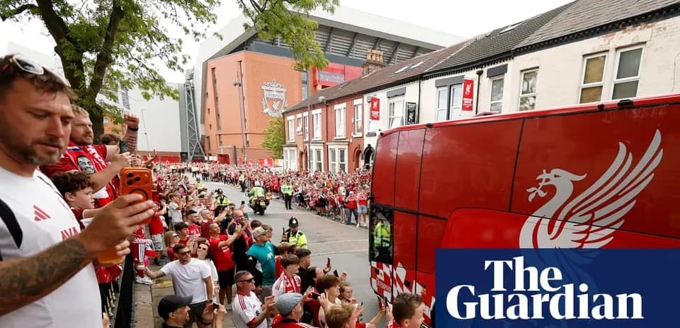 Liverpool fans cheering as team bus arrives at Anfield