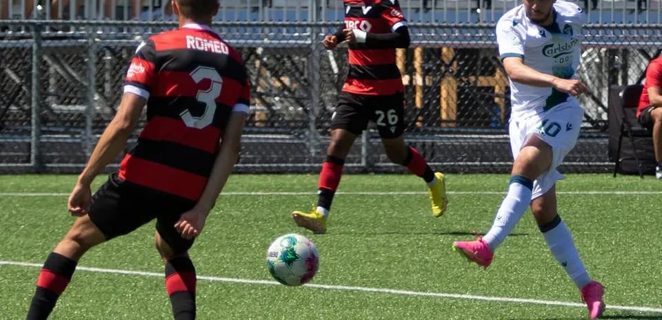 Player shooting the ball during match