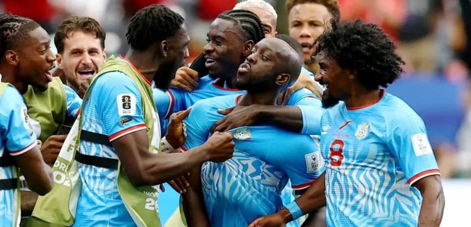 Players celebrating together after a goal