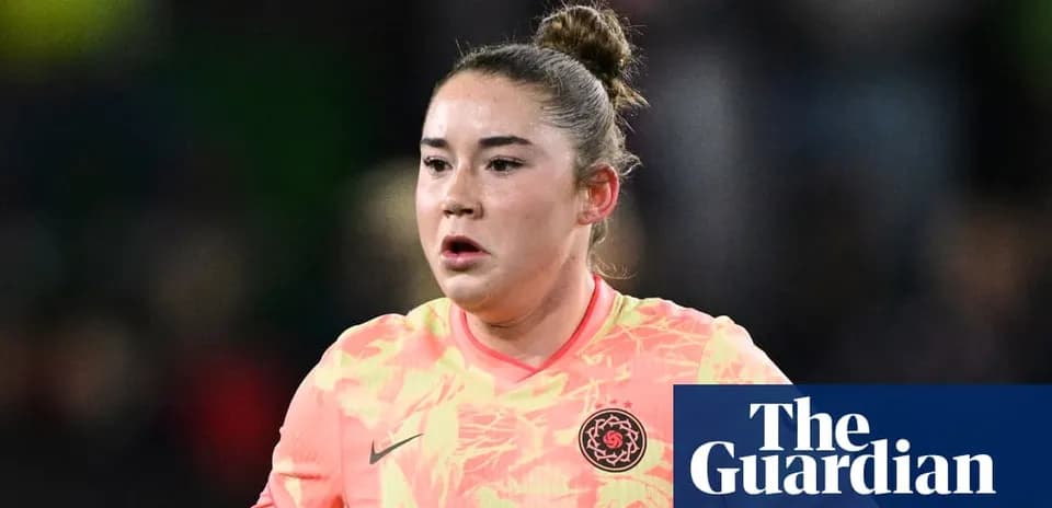 Goalkeeper in bright kit during match action