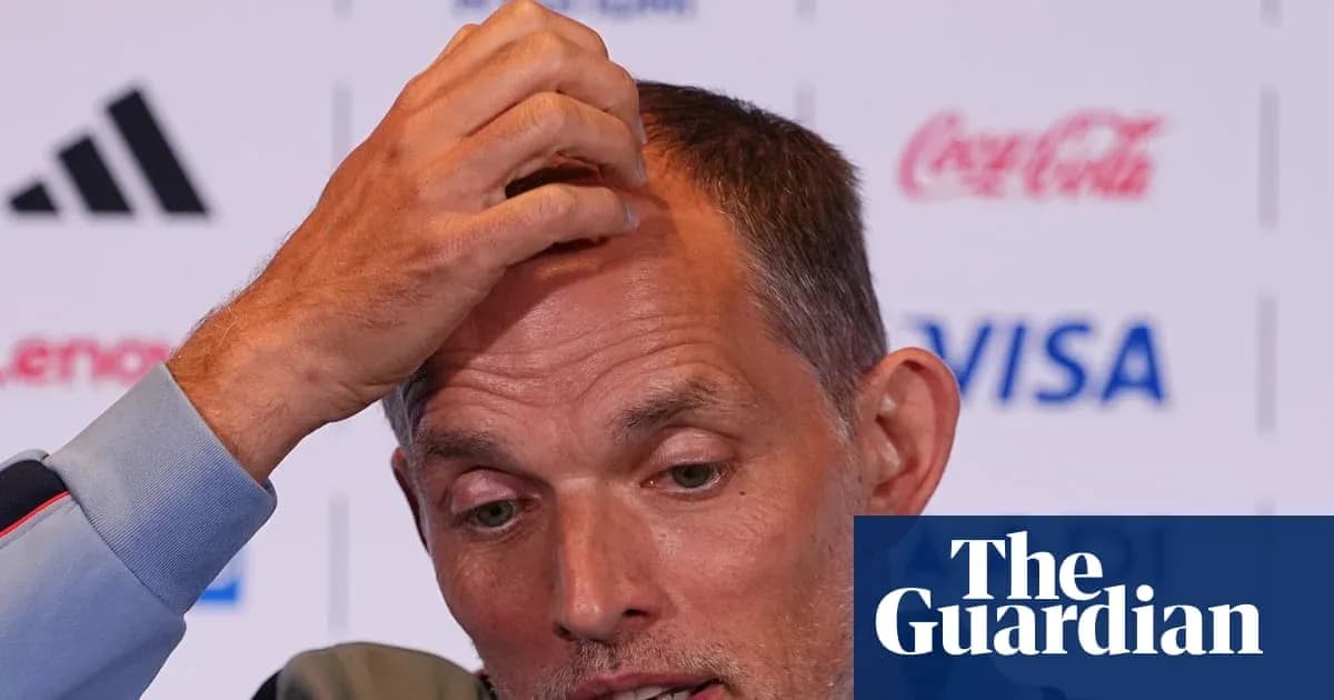 Manager speaking at press conference, hand on head