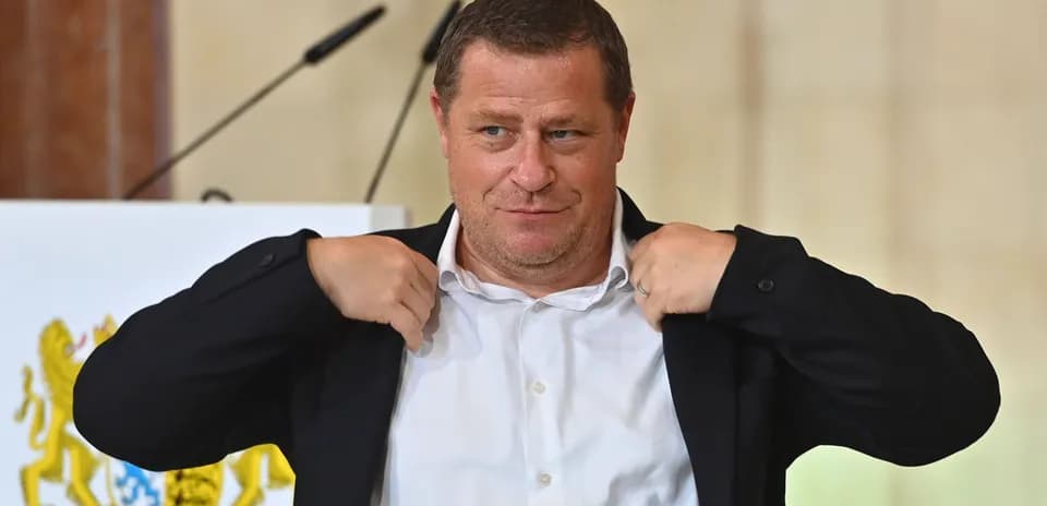 Man adjusting his jacket during a presentation