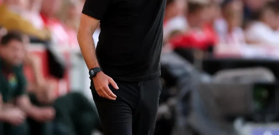 Coach directing players during a match