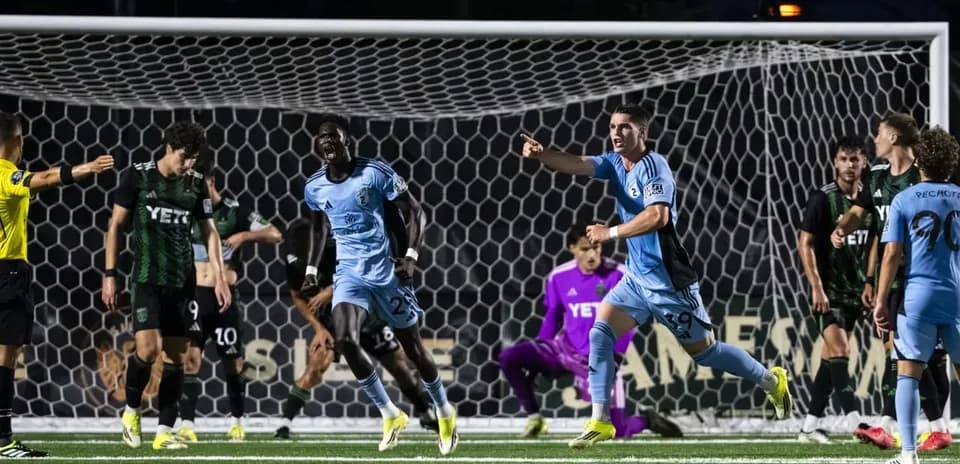 Players celebrating a goal in MLS Next Pro match
