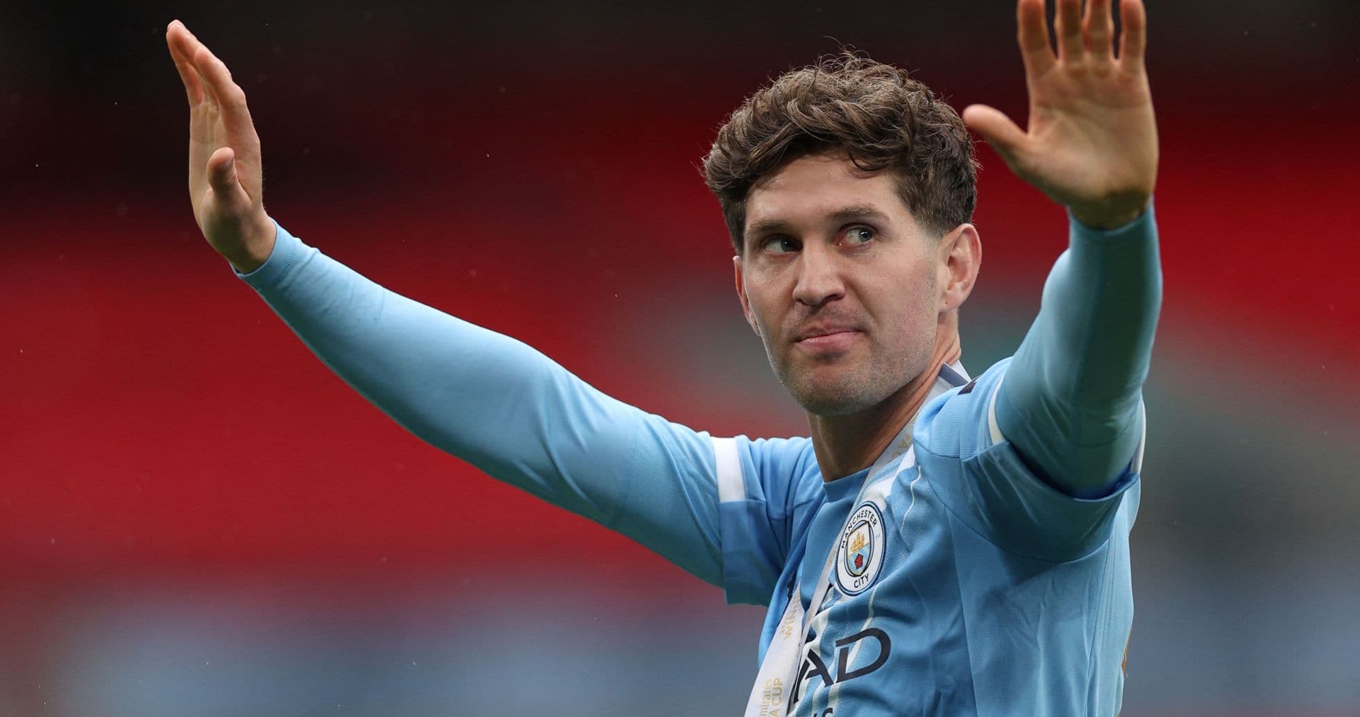 Player waving during match at stadium