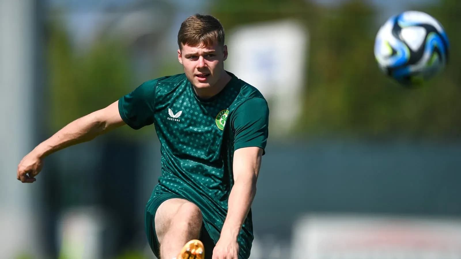 Player kicking a soccer ball during training session