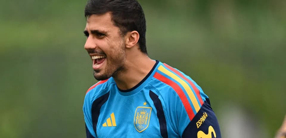 Player training in Spain kit, shouting during practice