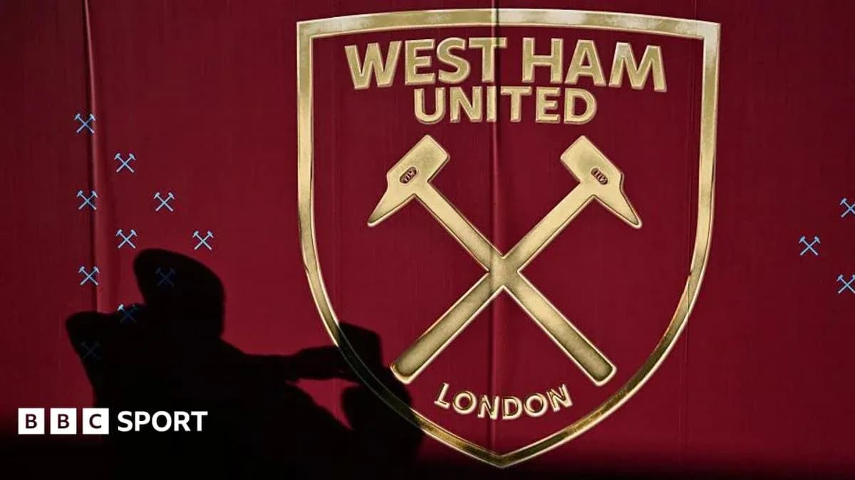 West Ham United logo displayed on a maroon background
