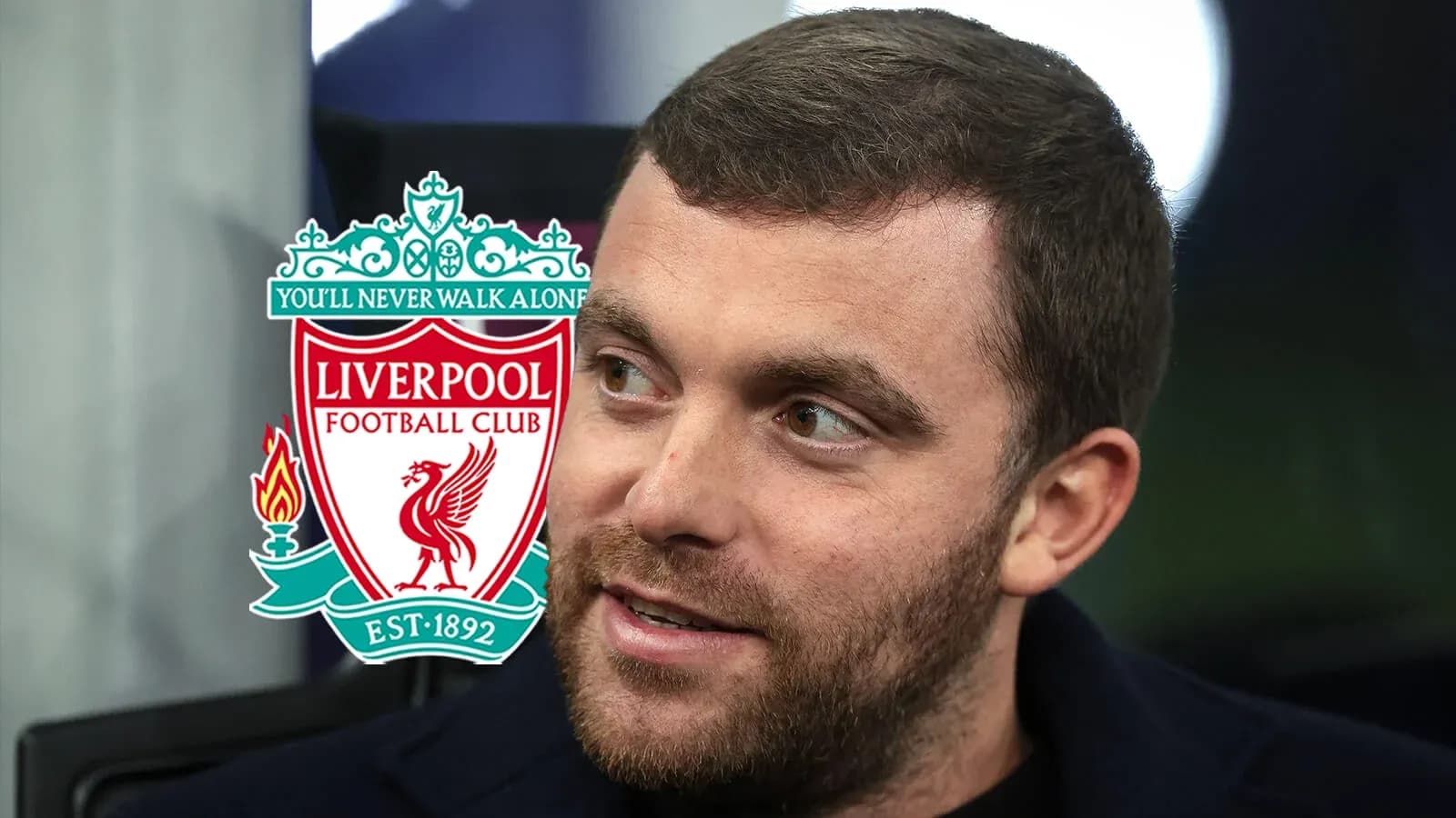 Man with Liverpool FC logo in background