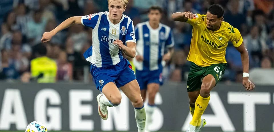 Player sprinting with ball during football match