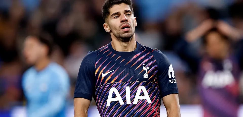Tottenham player walking on the pitch during match