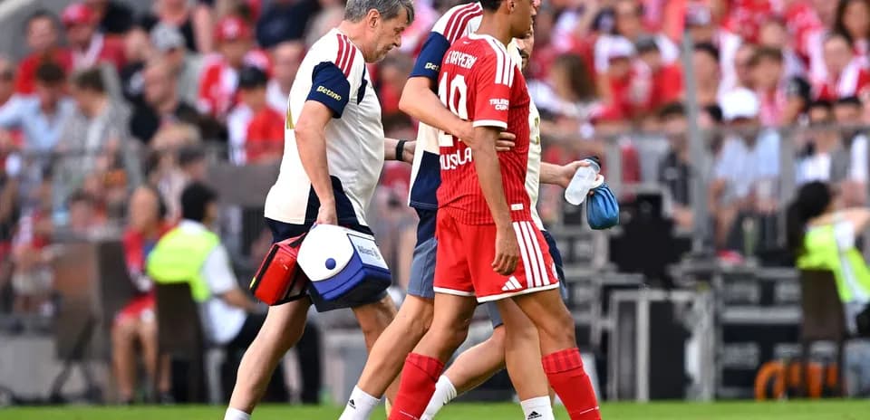 Player receiving medical assistance off the field
