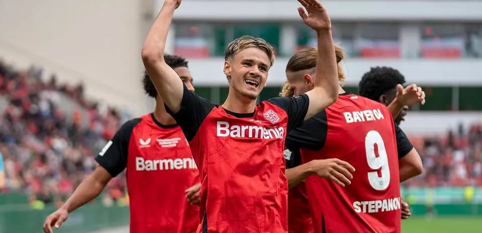 Bayer Leverkusen players celebrating a goal together