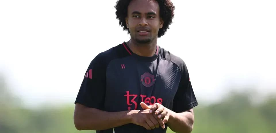 Player in Manchester United training kit on field