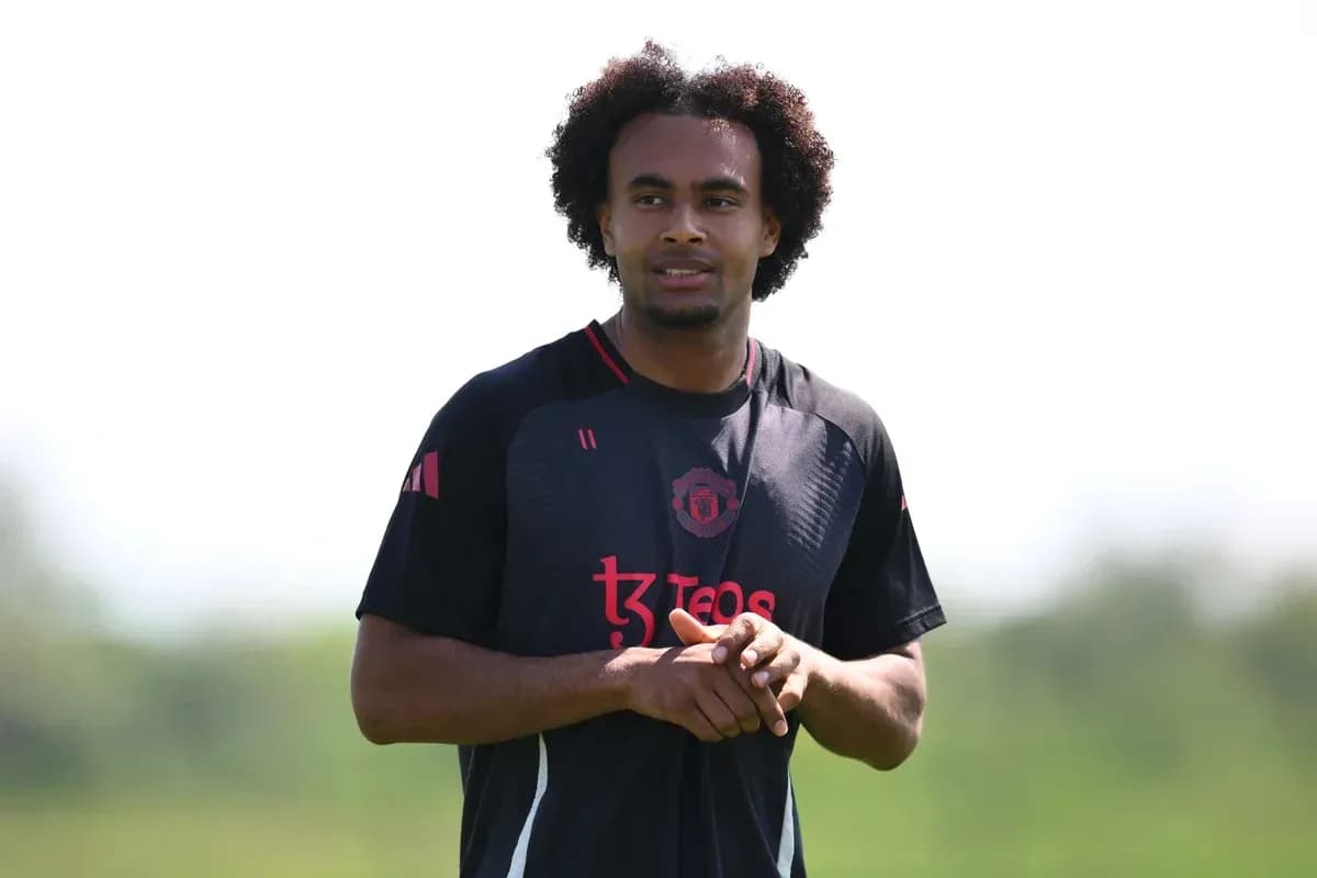 Player in Manchester United training kit on field