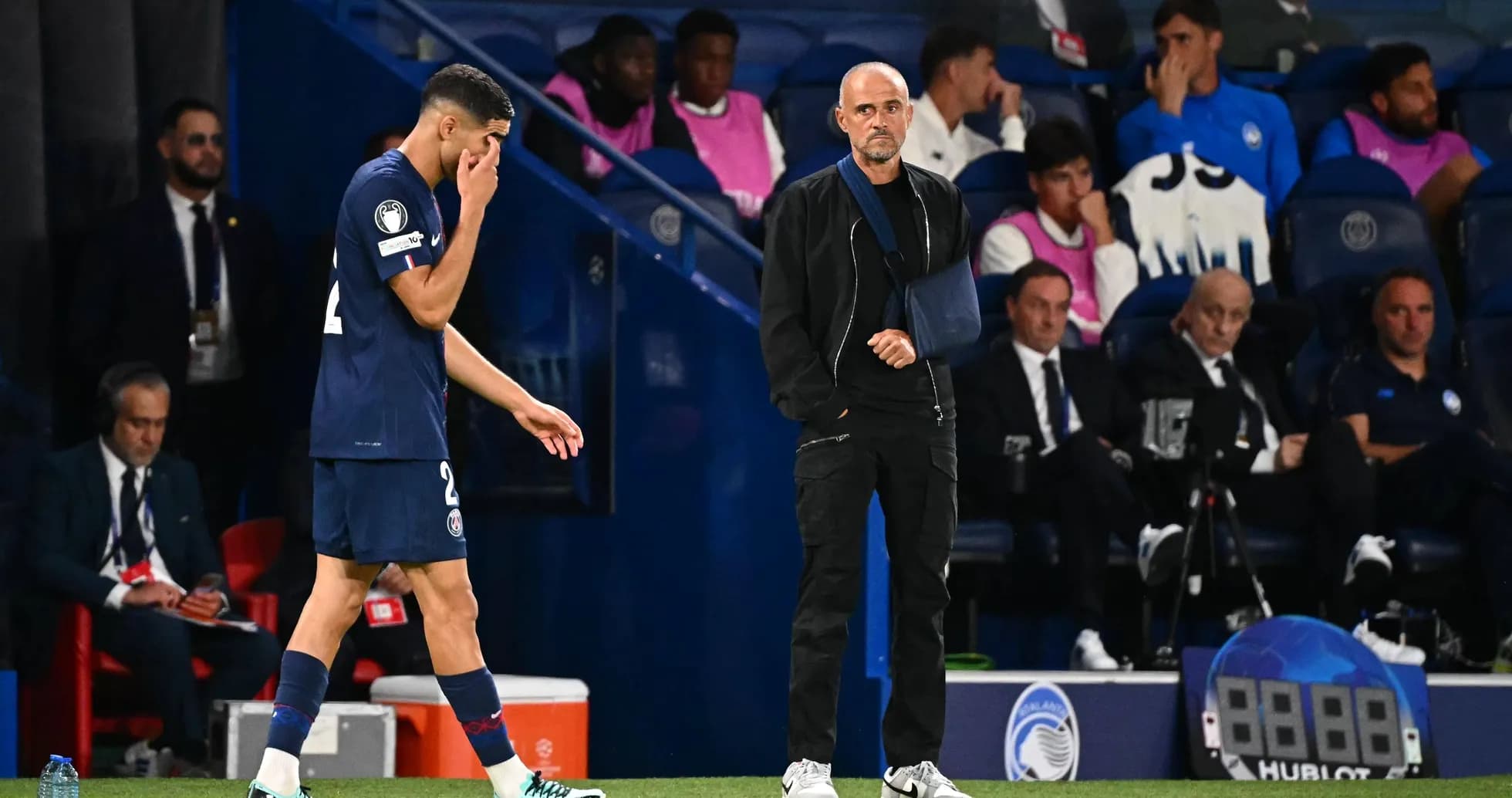 Player walking past coach during match substitution