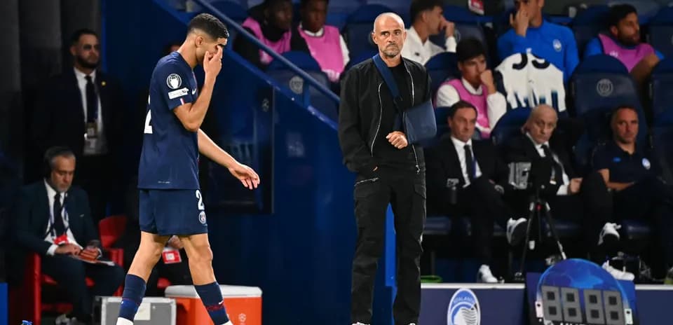Player walking past coach during match substitution