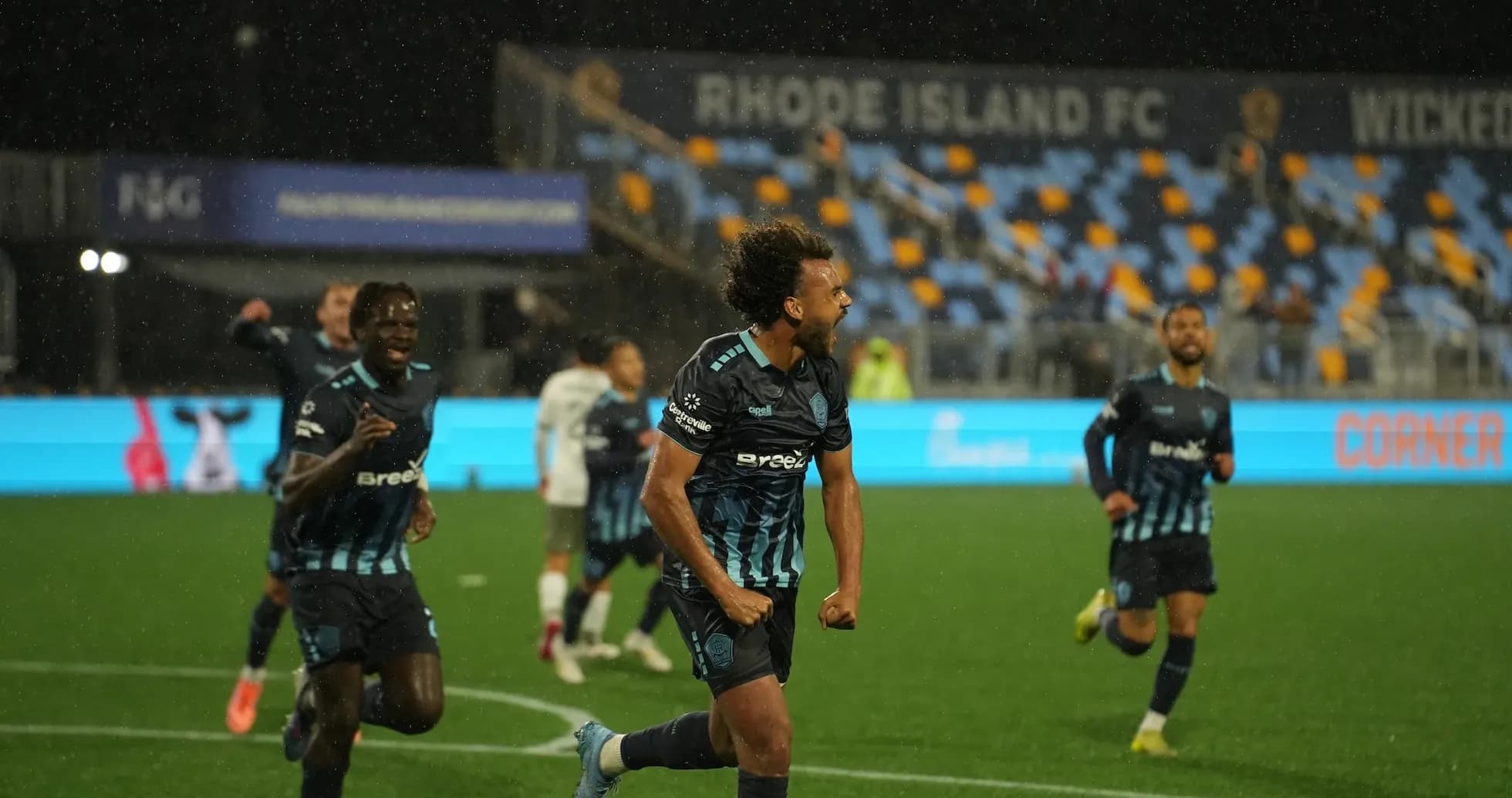 Rhode Island FC players celebrating a goal