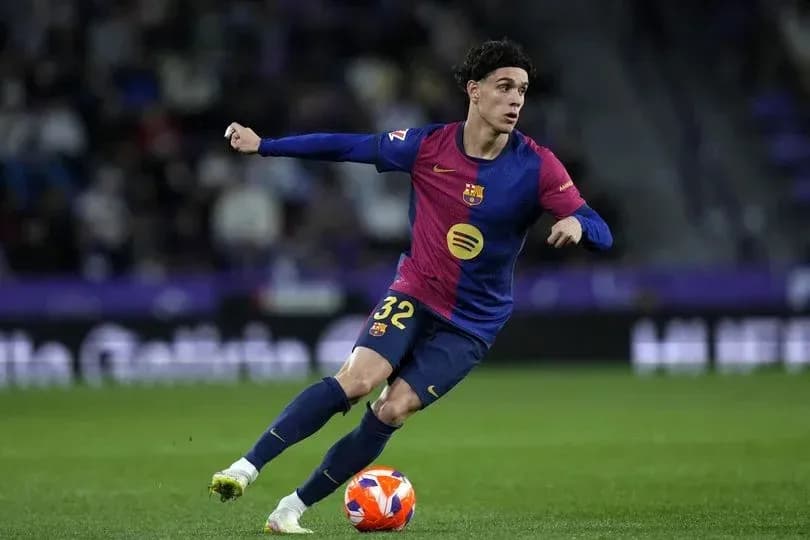 Barcelona player dribbling the ball during match