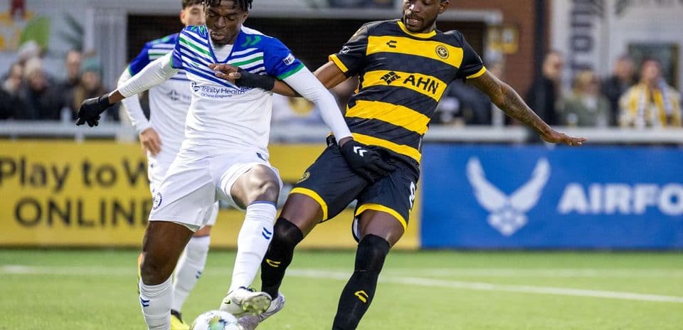 Players contesting for the ball during match
