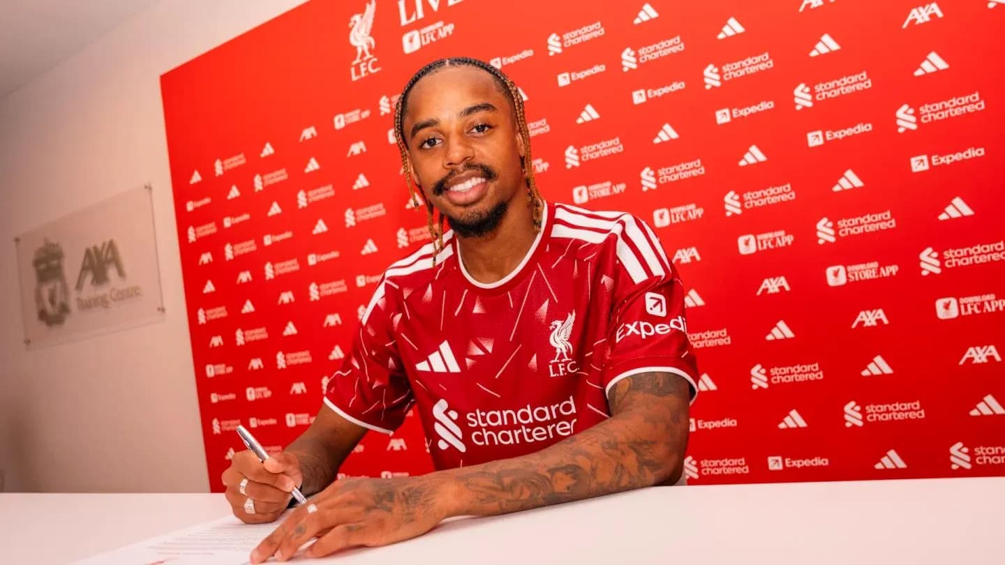 Player signing contract at Liverpool FC announcement event
