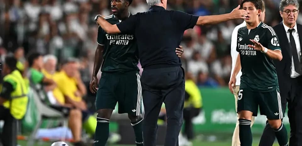 Coach instructing players during a match