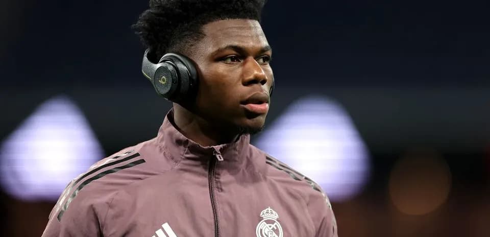 Player wearing headphones before match warm-up