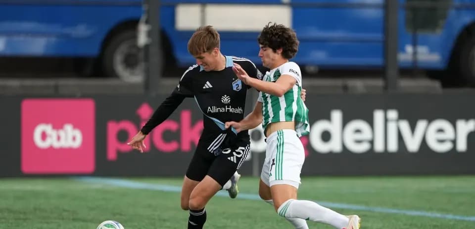 Players contesting for the ball during match