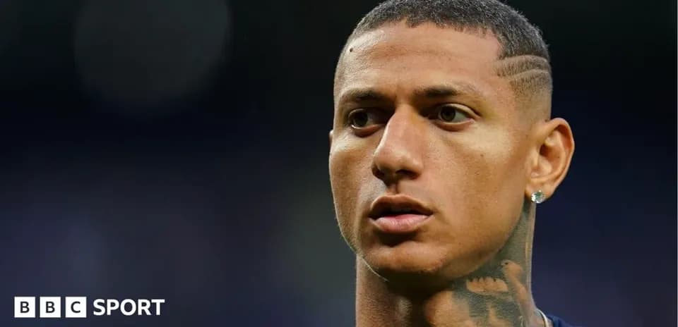 Player with short hair and tattoos in stadium