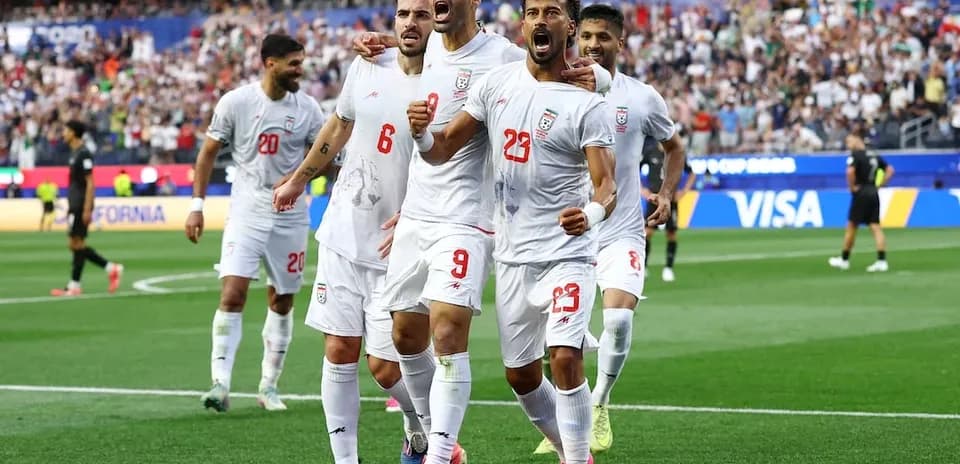 Iran players celebrating a goal during match