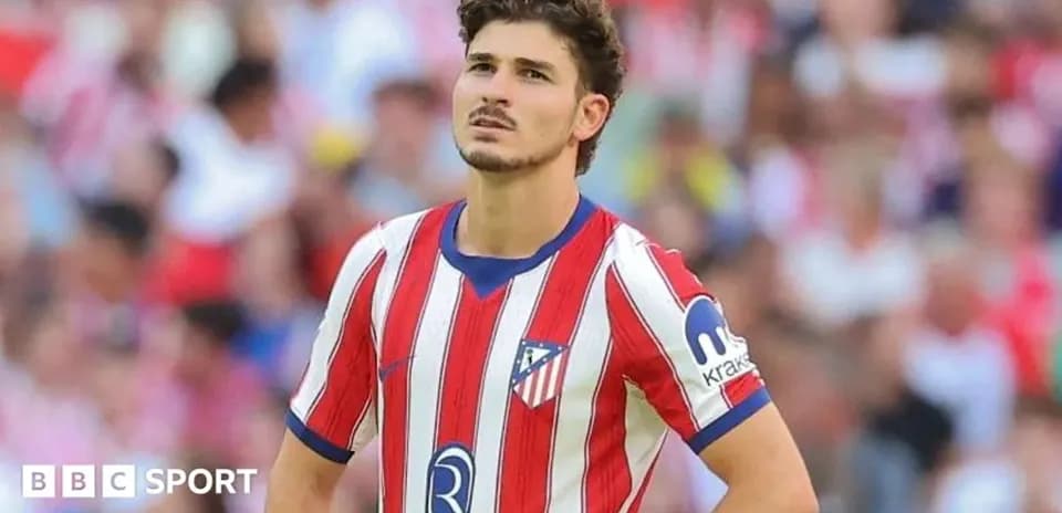 Atletico Madrid player looking pensive on the field